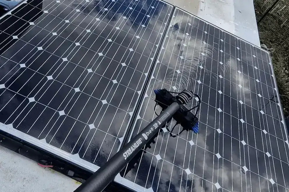 Soft brush clean on roof-mounted solar panels